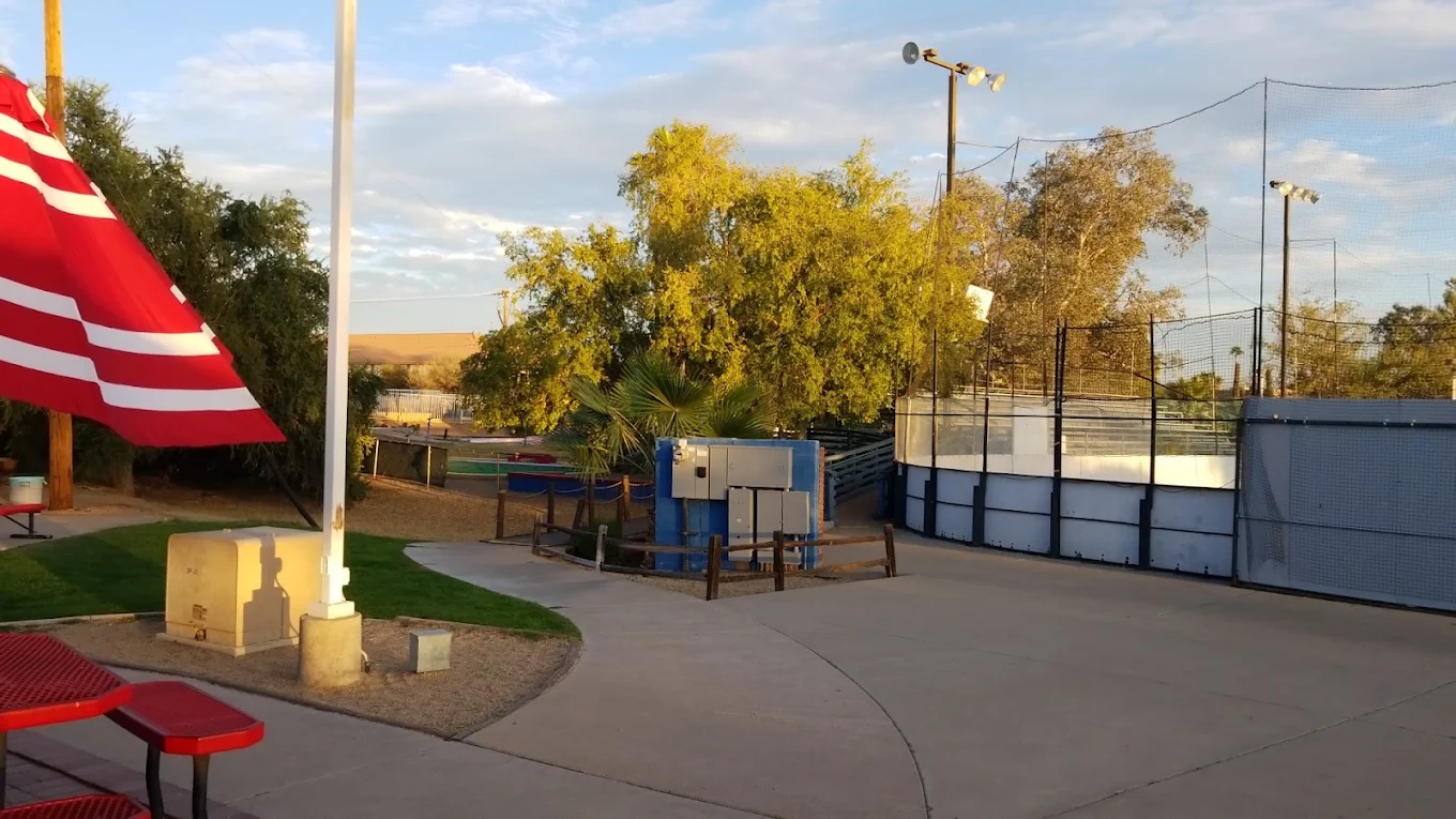 American flag flying over the batting cages